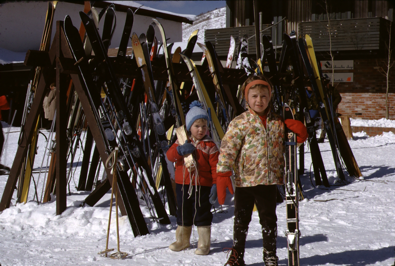 Vintage Color photo of two small girls preparing to ski at Vail Lodge, Colorado, shot by W. R. Allen